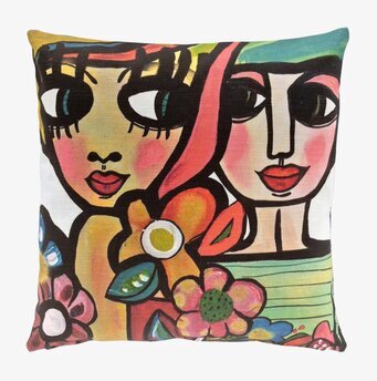 Bild av kuddfodral med färgstarka ansikten och blommor