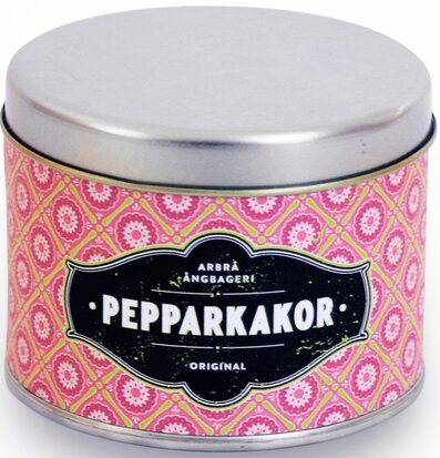 Bild av rund plåtburk med pepparkakor i rosa design