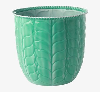 Bild av grön blomkruka med naturinspirerat mönster