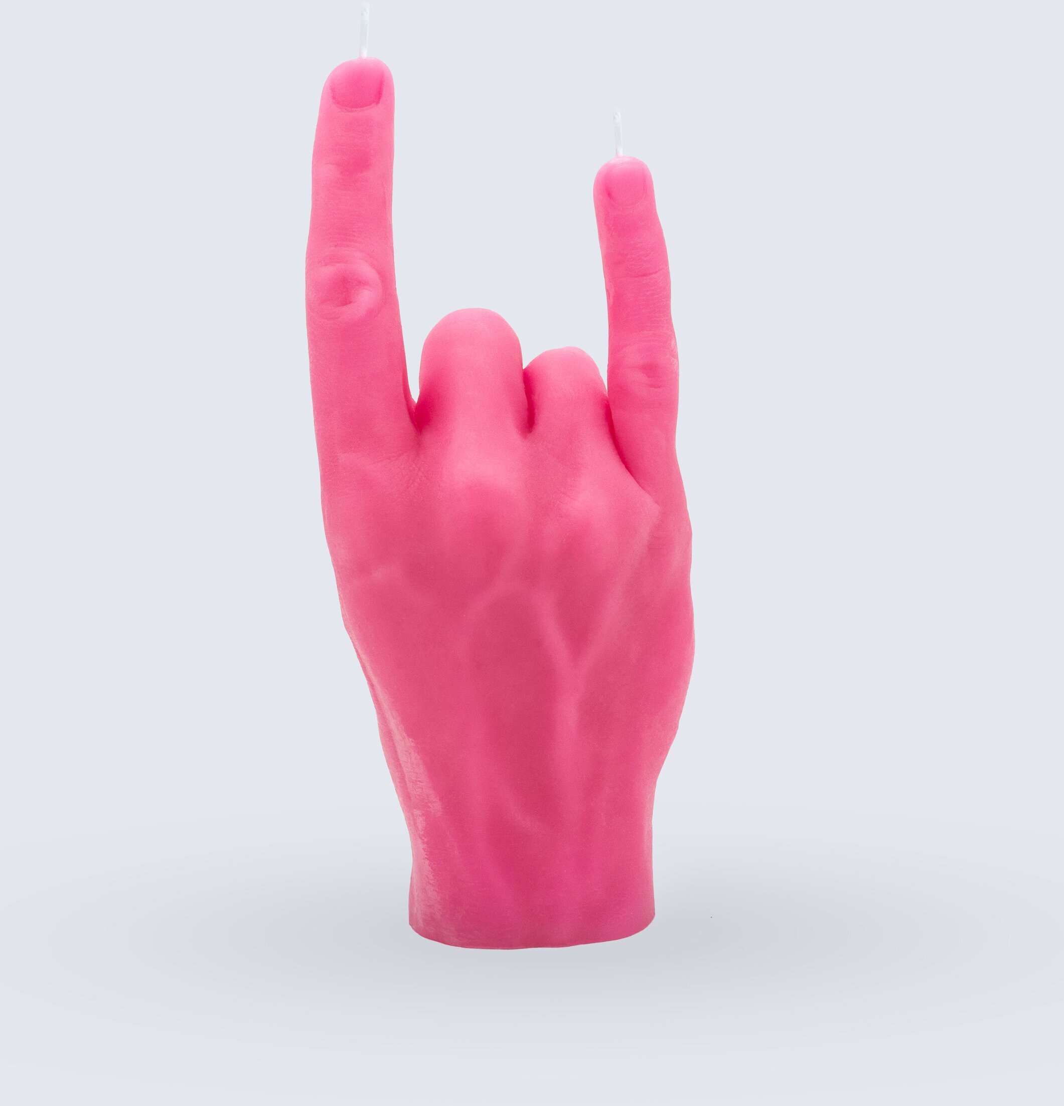 Foto av ljusstake formad som hand i rosa rockstil