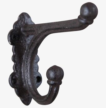 Bild av en robust och dekorativ väggkrok i gjutjärn