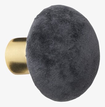 Bild av elegant sammetknopp med mässingsdetaljer