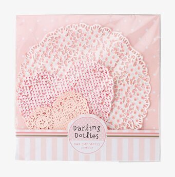 Bild av dekorativa tårtpapper i rosa och vitt