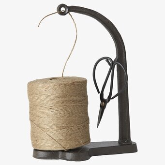 Foto av elegant och funktionell trådhållare med sax