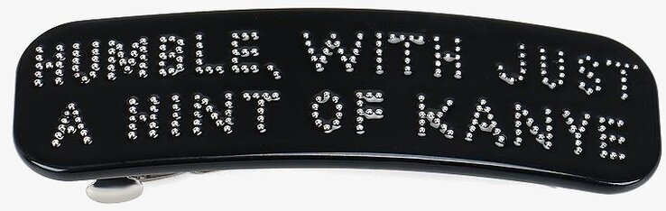 Bild av hårspänne med elegant text och design