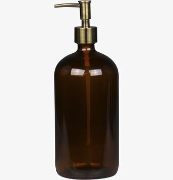 Bild av elegant glasflaska med pump och metallisk nyans