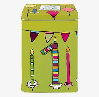 Bild av lekfull grön plåtburk med färgglada dekorationer