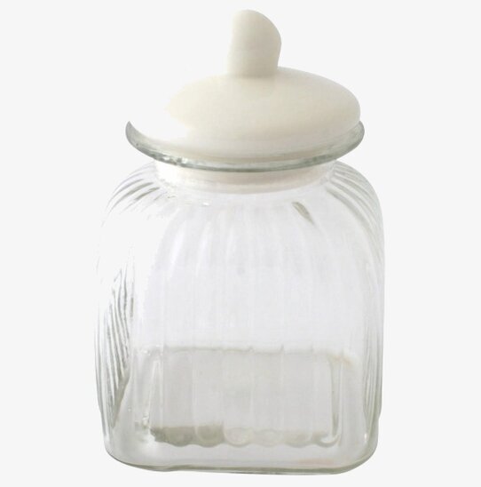 Bild av glasburk med porslinslock och räfflad design