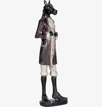 Bild av unik skulptur: hästhuvud med klädd kropp