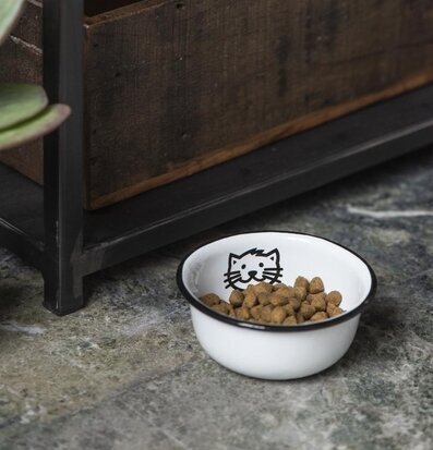 Bild av stilren kattskål med industriell inredning