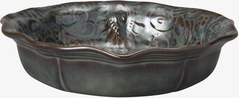 Foto av skål med böljande mönster och jordnära toner