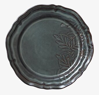 Bild av en detaljrikt utformad tallrik med mönster