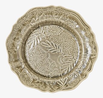 Bild av runt fat med arabesque-design och sandtoner