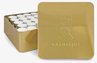 Bild av elegant plåtburk för värmeljus i guldton