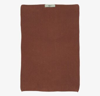 Bild av rustik brun handduk med nordisk design