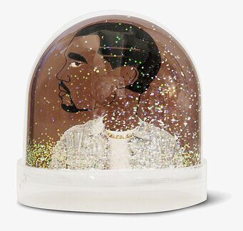 Bild av snöglob med man i profil och glittereffekt