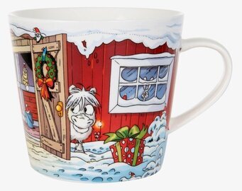 Bild av porslinsmugg med julmotiv och vinteridyll