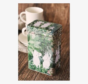 Bild av färgstark kaffeburk med Mumintroll motiv