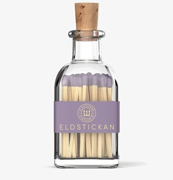 Foto av elegant glasflaska med tändstickor i stilren design