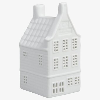 Foto av ljuslykta formad som ett kanalhus i keramik