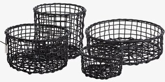 Foto av fyra moderna, svarta korgar i olika storlekar