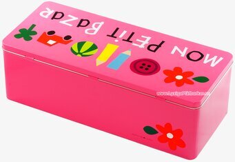 Bild av färgglad rosa plåtburk med lekfull design