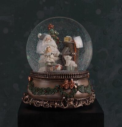 Bild av en charmig snöglob med julscen och speldosa