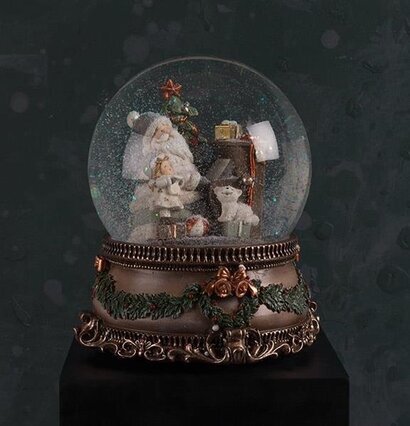 Bild av en charmig snöglob med julscen och speldosa