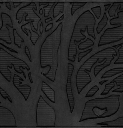 Bild av dörrmatta med grenmönster och fågelsilhuetter