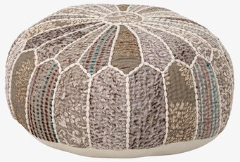 Bild av sittpuff i jordnära toner och pastellfärger