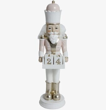 Bild av dekorativ nötknäppare i rosa med almanacka