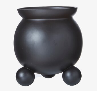 Bild av stilren och funktionell svart kruka med fötter