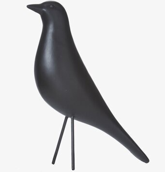Bild av stilren, svart fågelskulptur i minimalistisk design