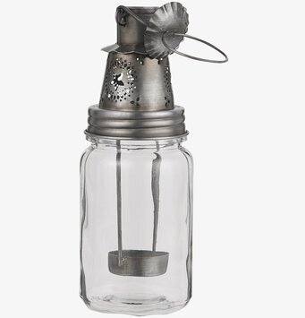 Bild av vintage ljuslykta i silver med blommotiv