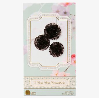 Bild av eleganta svarta pompoms i dekorativ förpackning