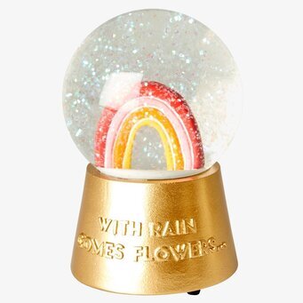 Foto av färgglad snöglob med regnbåge och musik