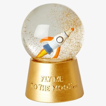 Bild av snöglob med rymdtema och musikaliska inslag