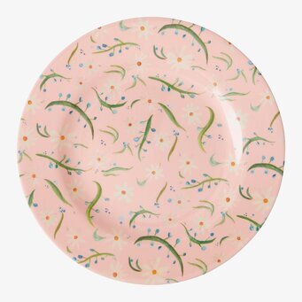 Bild av livfull assiett med blommönster och glansig yta