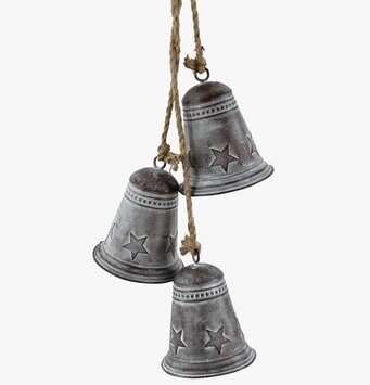 Bild av rustika bjällror med antik finish och stjärnmönster