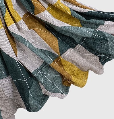 Foto av geometrisk textil med dova färger och mönster