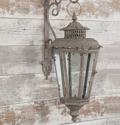 Foto av elegant vägglykta med antik design