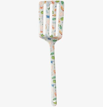 Bild av färgglad stekspade med fiskmönster