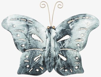 Bild av fjärilsprydnad i hamrad plåt och metall