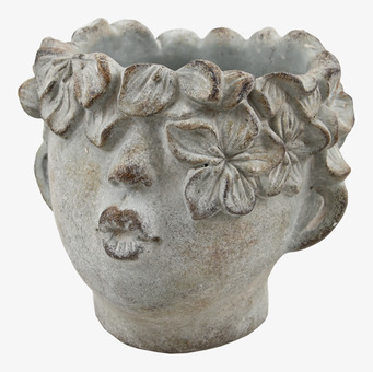 Bild av unik kruka med ansiktsdesign och antik finish