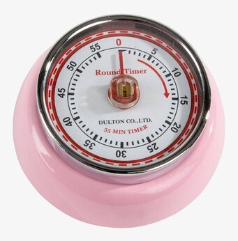 Bild av rosa kökstimer med analog urtavla och metallkant