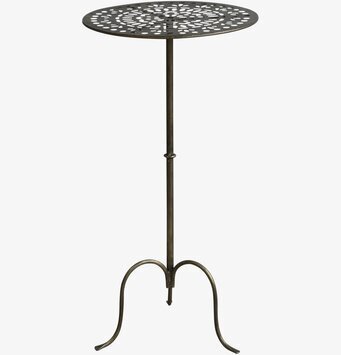 Foto av elegant runt bord med antik mässingsfinish