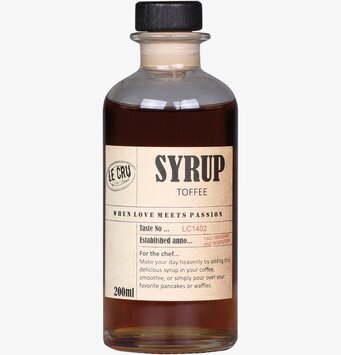 Bild av sirapsflaska med rustik etikett och beskrivning