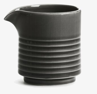 Bild av stilren grå mjölkkanna med elegant design