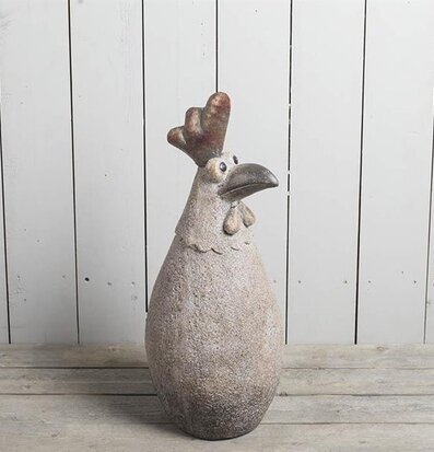 Bild av stiliserad tuppskulptur i grått och brunt