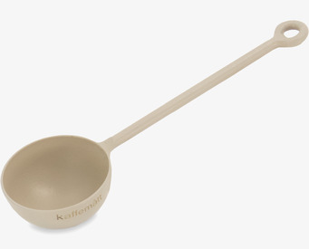 Bild av stilrent och funktionellt kaffemått i metall